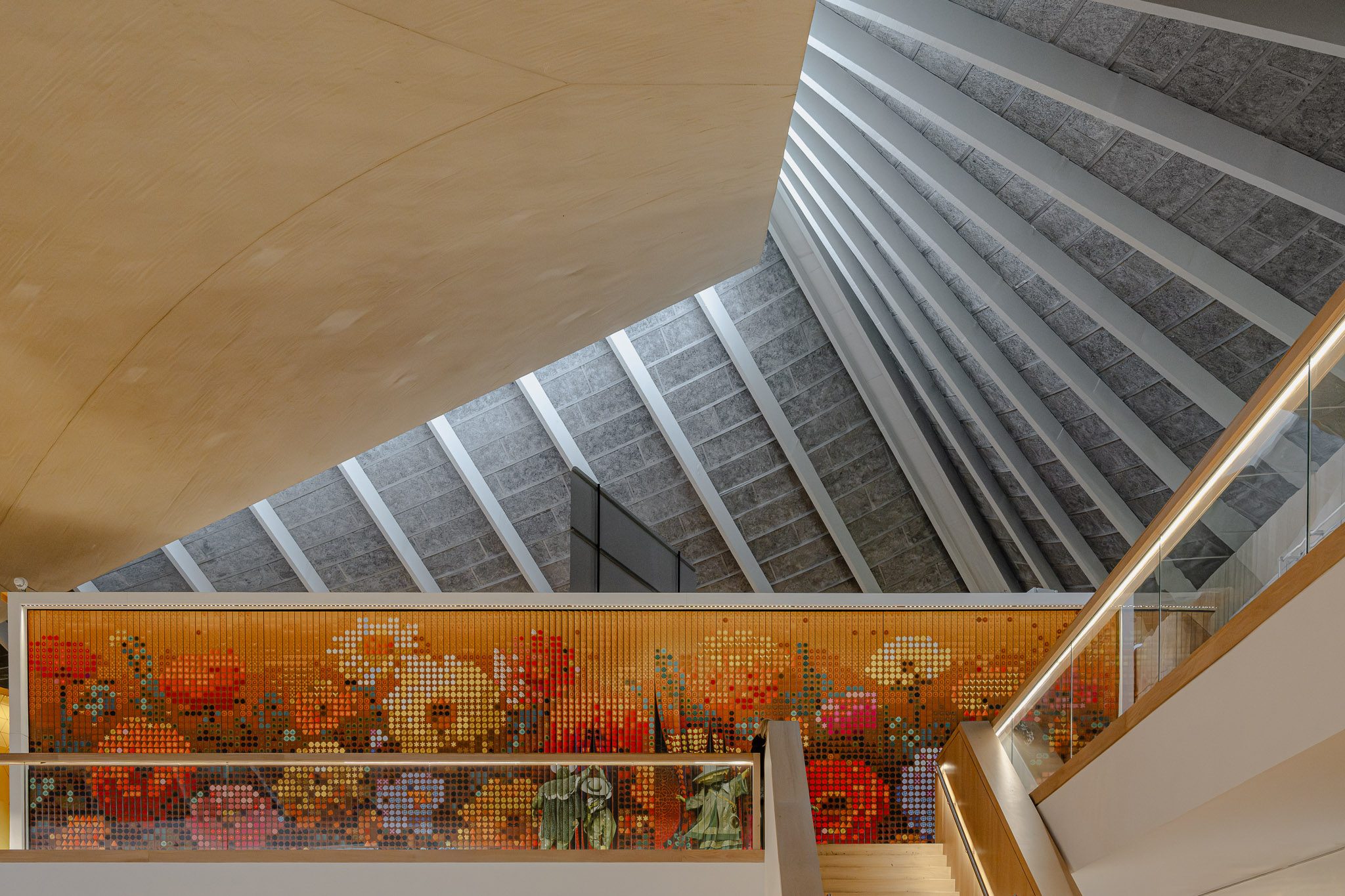 Pixel mosaic along the balustrade beneath the roof structure, Design Museum