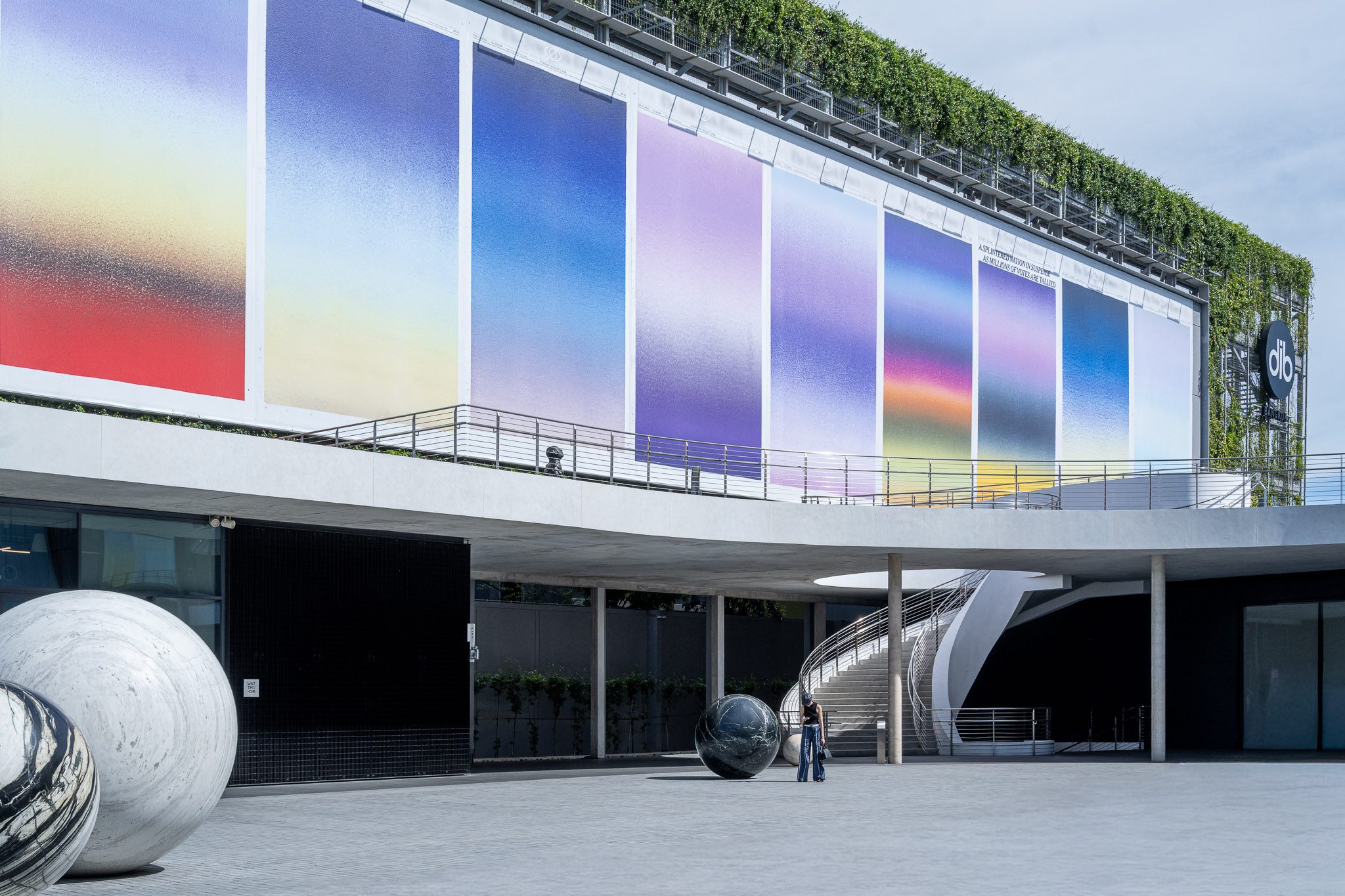 Gradient artwork on the façade above the entrance terrace, Dib Bangkok