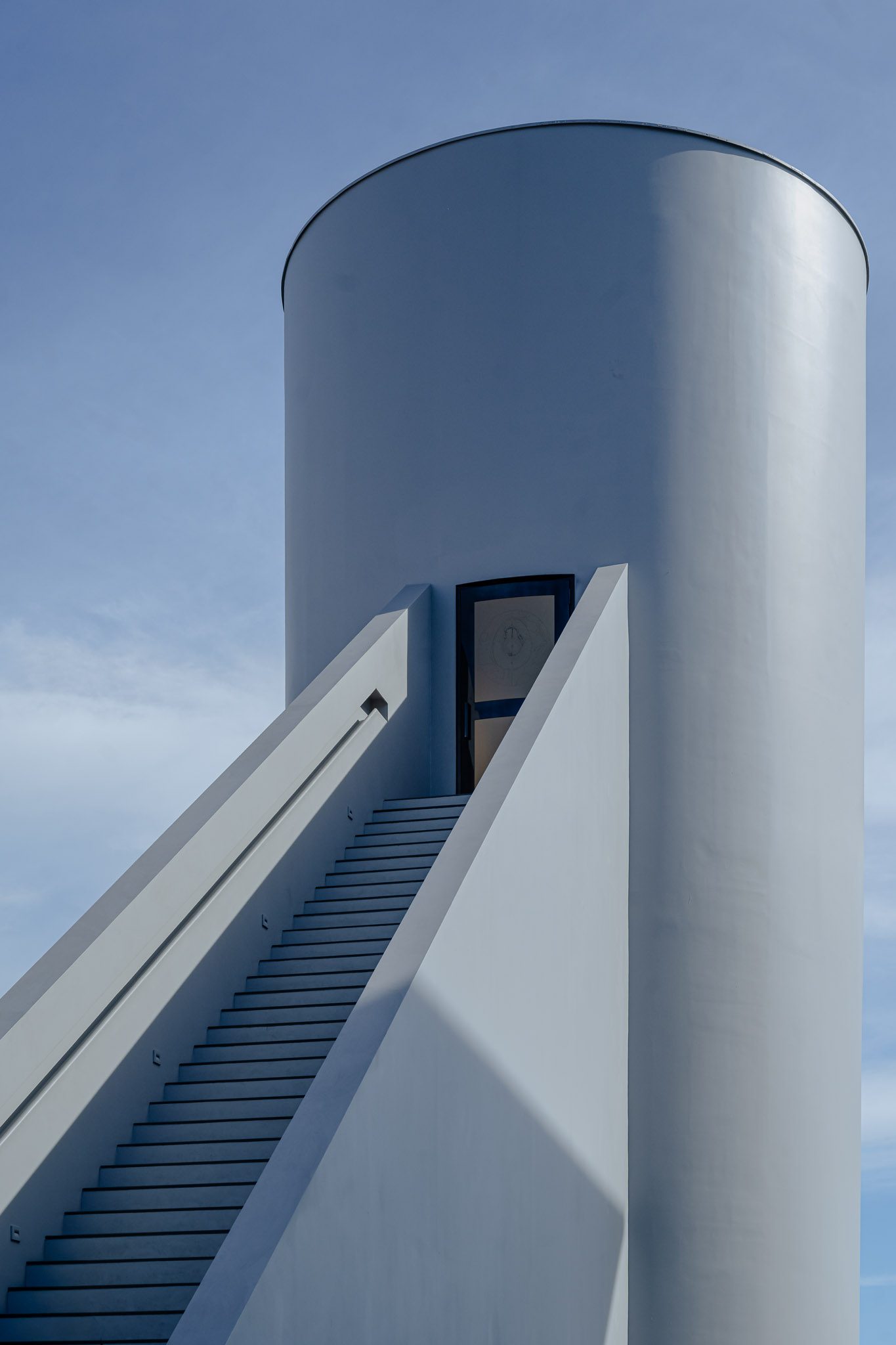 Exterior stair rising up the cylindrical tower, Dib Bangkok