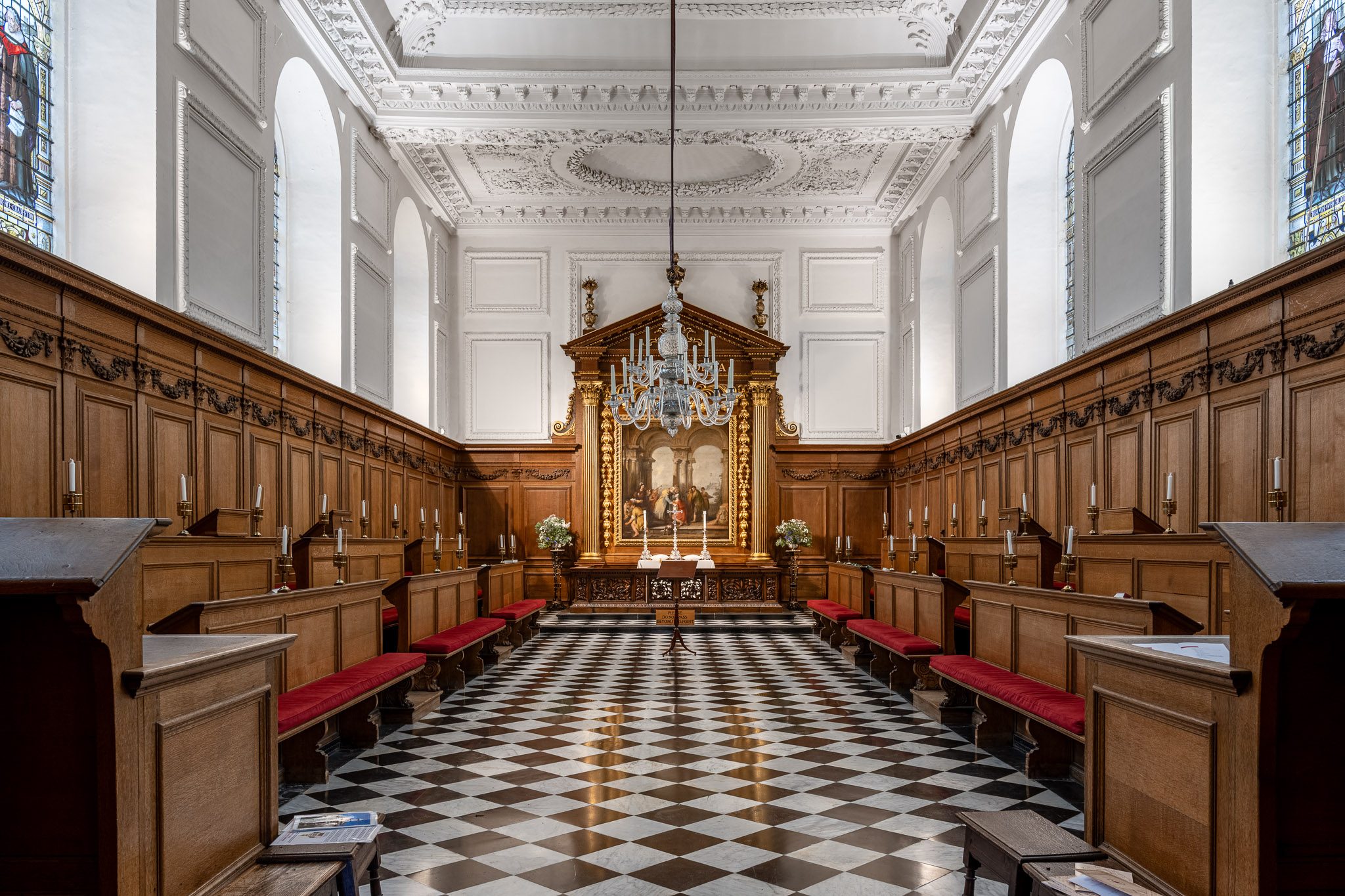 Chapel interior with timber stalls and a chequered floor, Emmanuel College