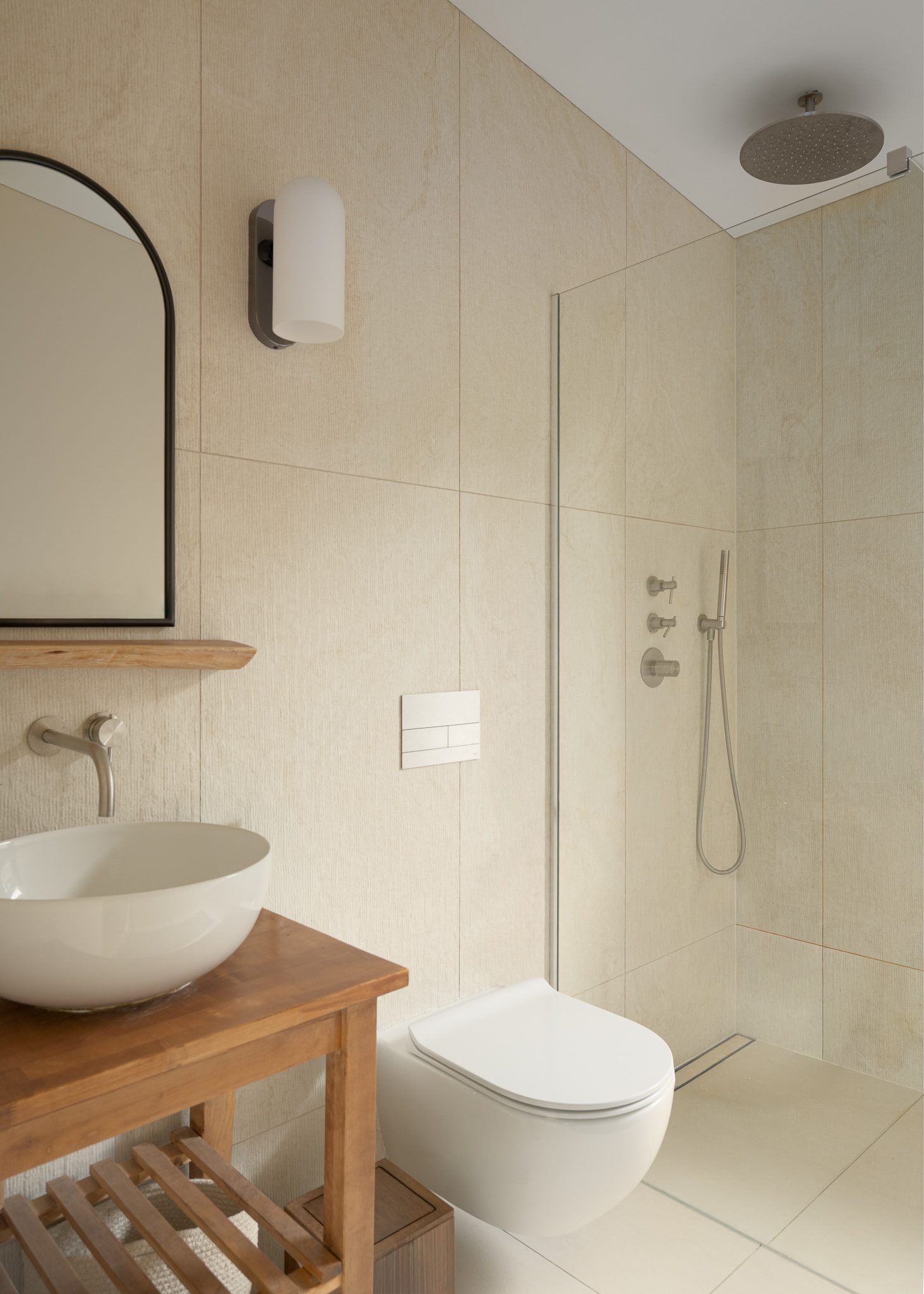 Bathroom with a stone basin on a timber stand and walk-in shower