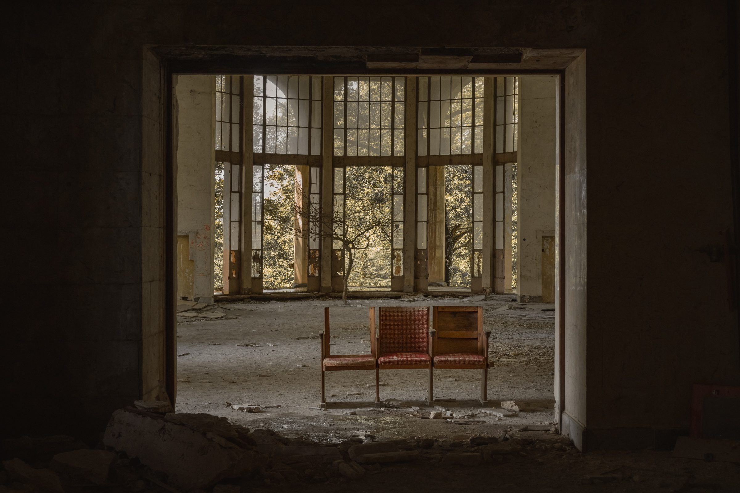 A pair of chairs framed by a dark doorway, Sanatorium Metallurgist