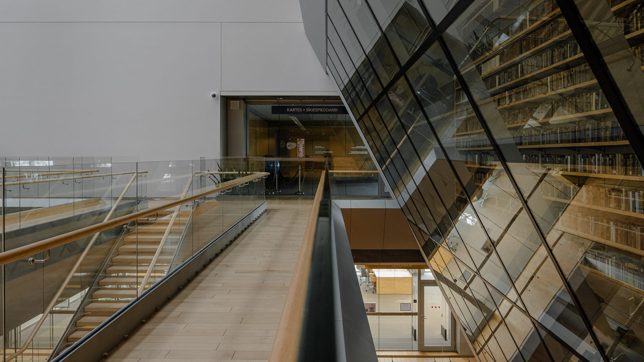 Escalator beside the glazed book wall, National Library of Latvia
