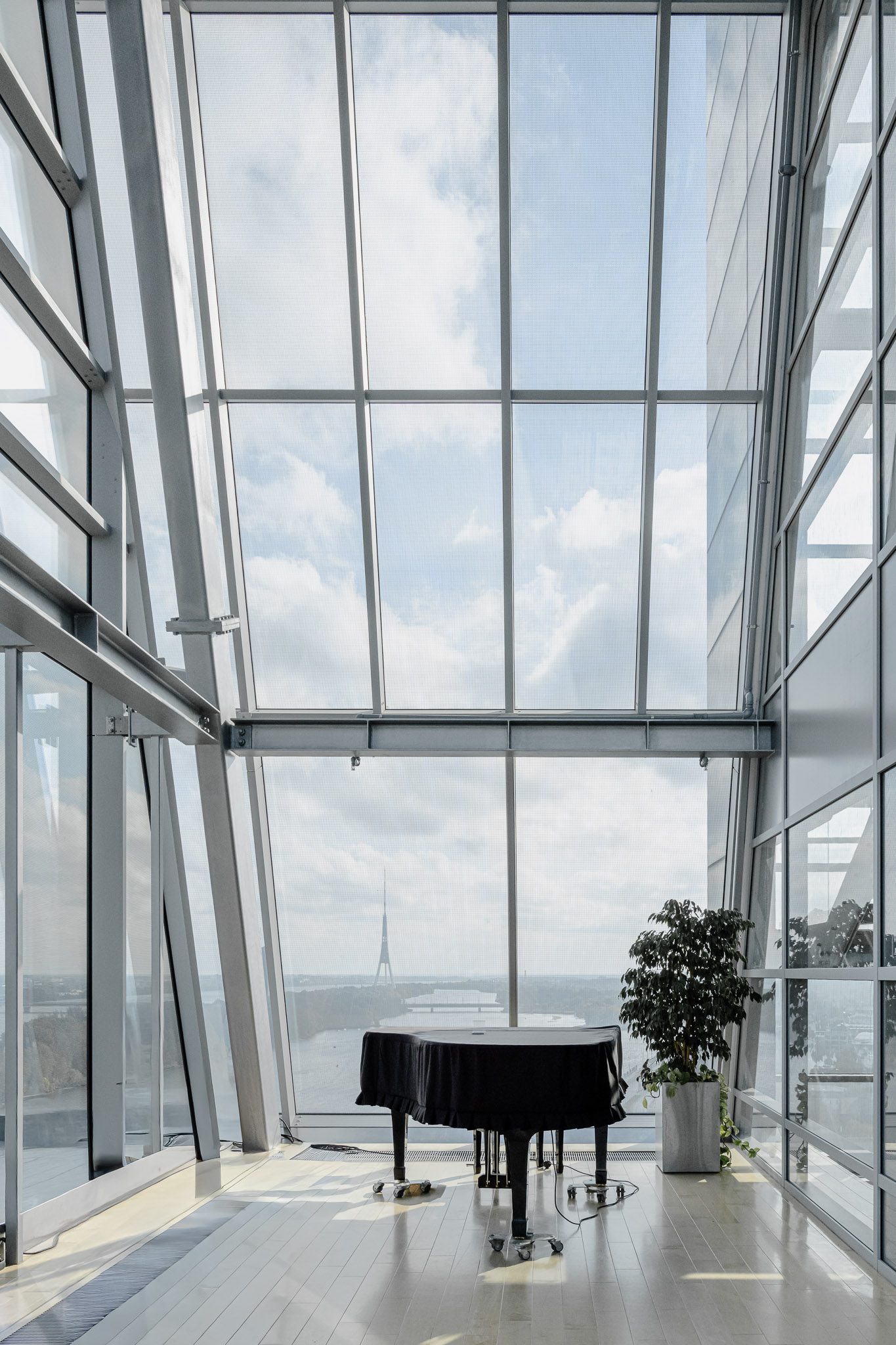 Grand piano in a glazed room overlooking Riga, National Library of Latvia