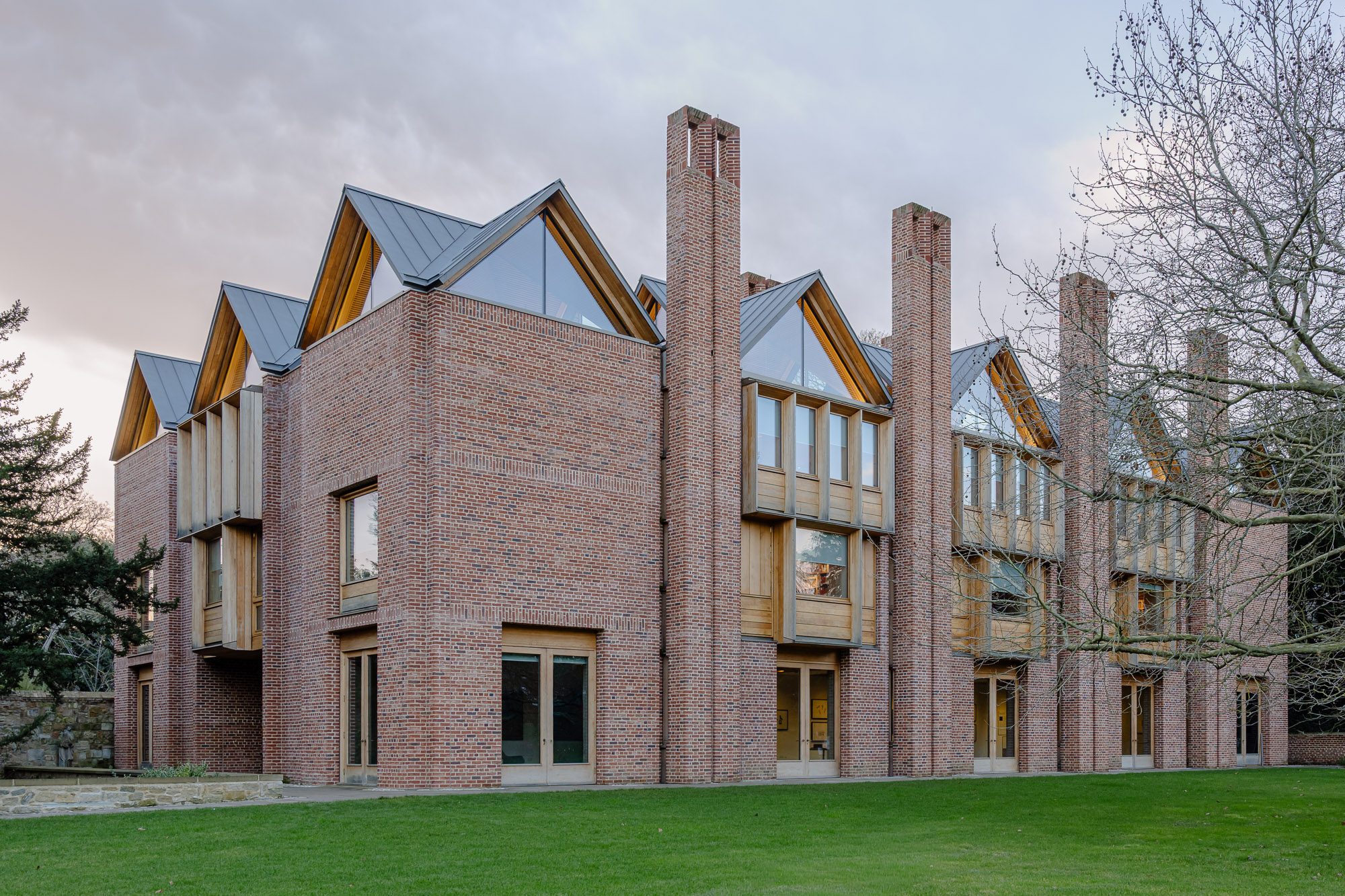 New library at Magdalene College by Níall McLaughlin Architects, Cambridge, at dusk