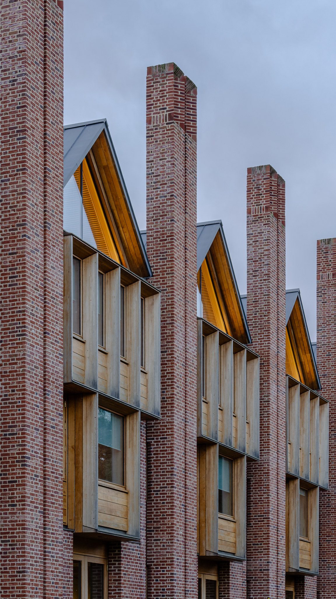 Brick piers and timber bays along the library façade, Magdalene College