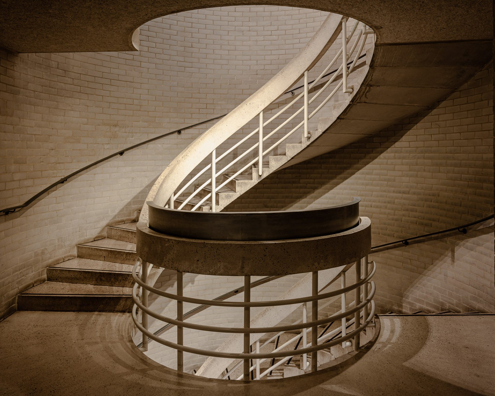 Spiral staircase in pale brick, Murray Edwards College