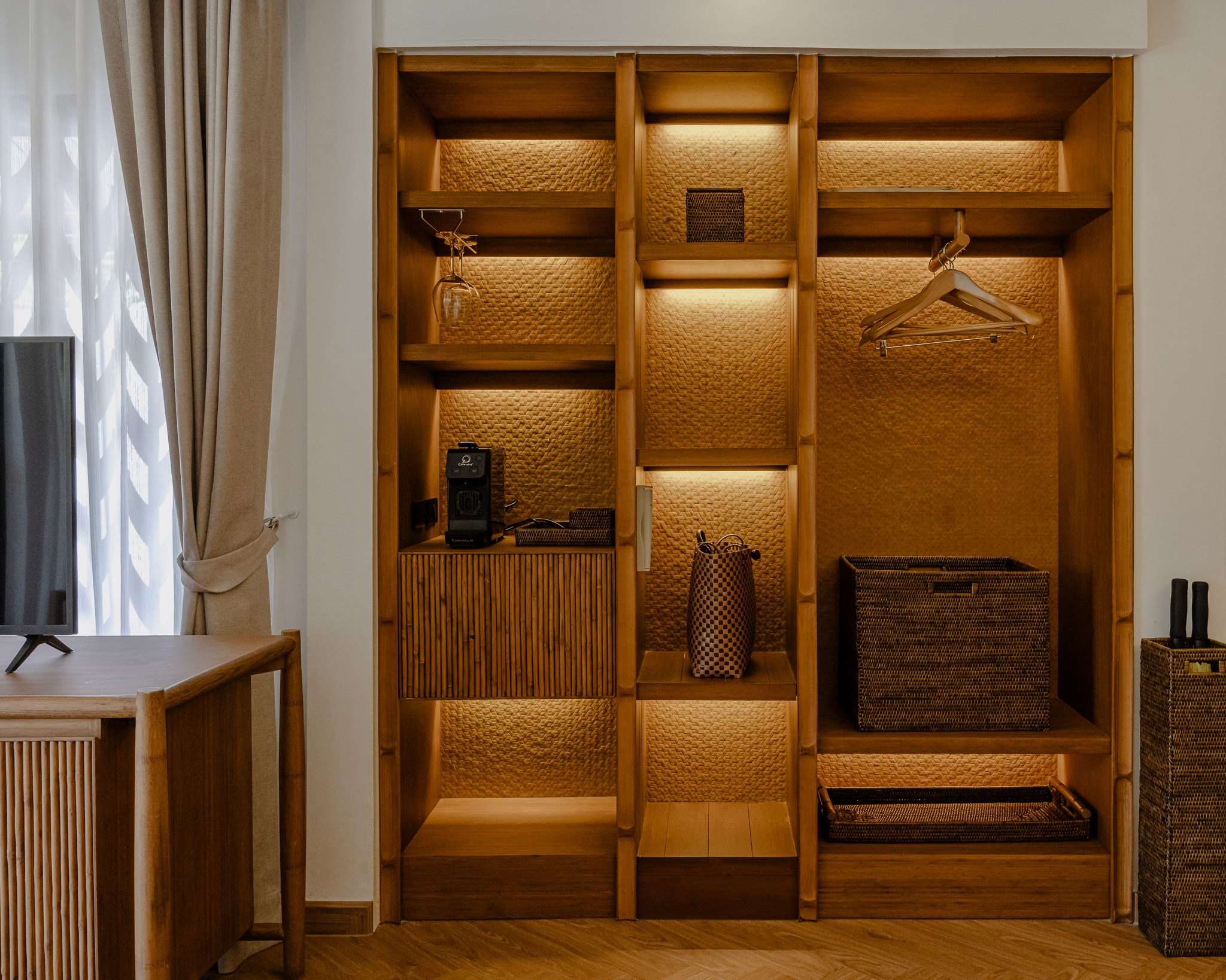 Lit bamboo wardrobe niche in a villa, Thai Cottage